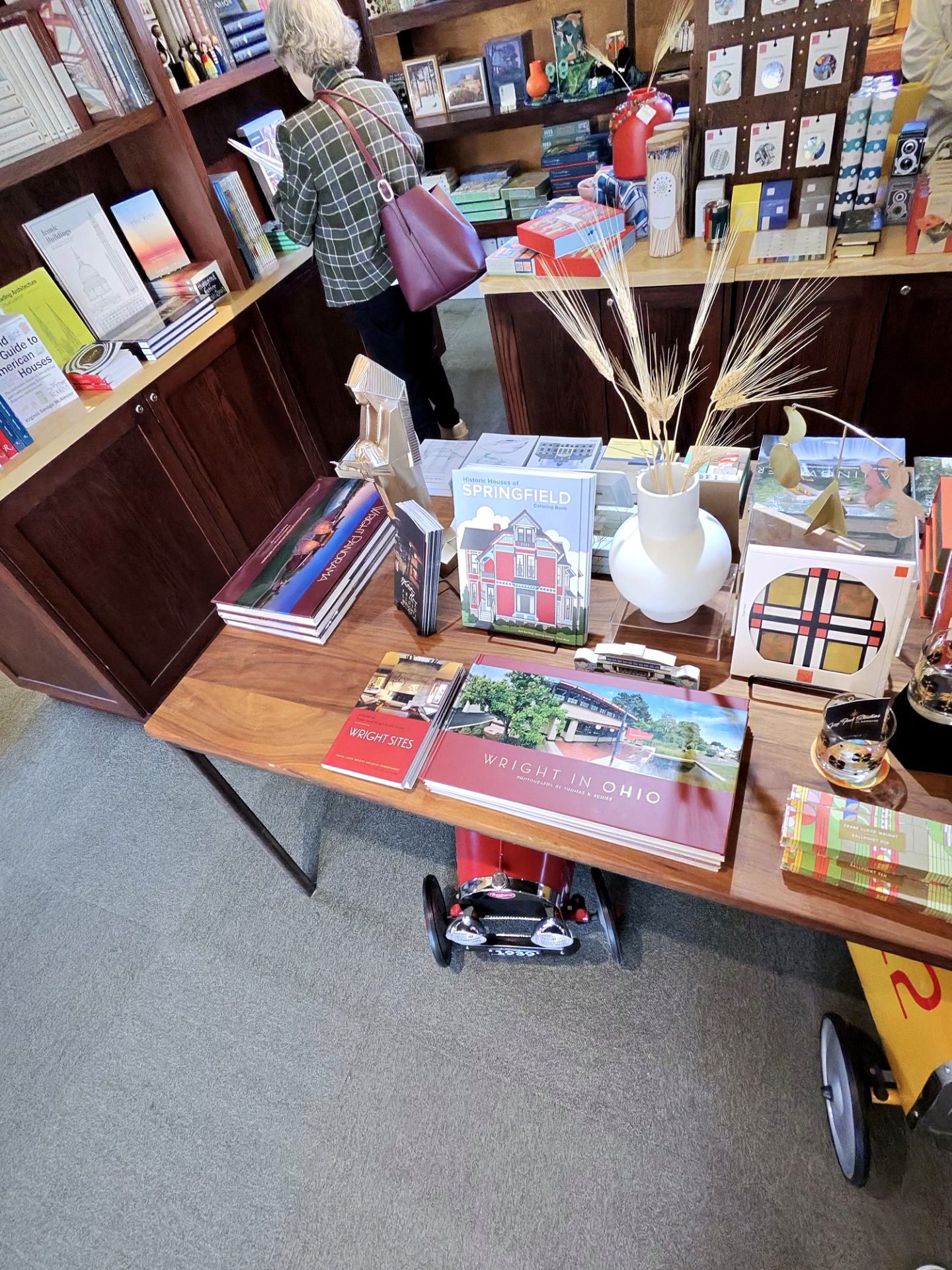Westcott House gift shop table stacked with Wright books including Wright in Ohio and Wright Panorama