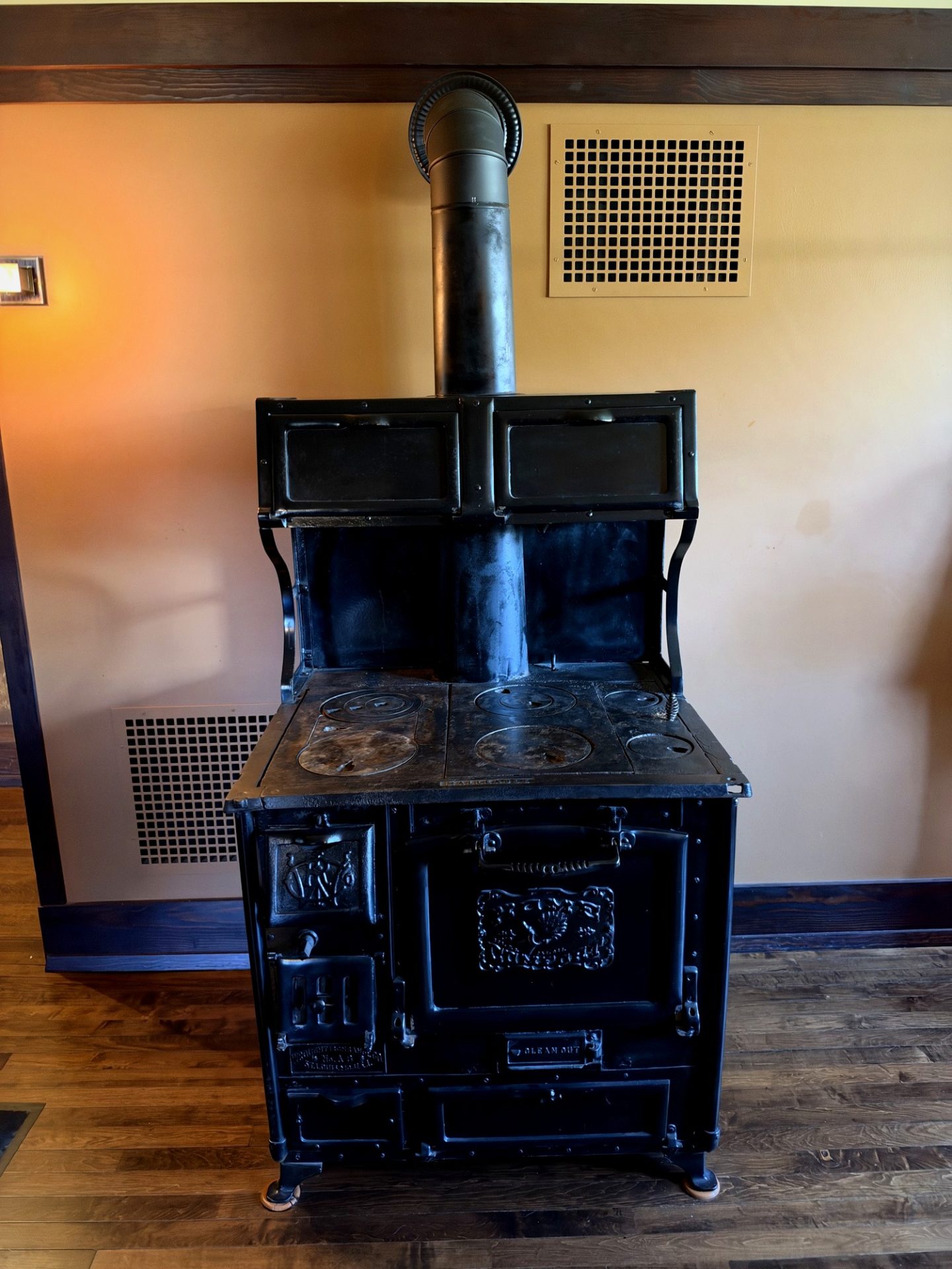 Black cast-iron Home Comfort wood-burning cook stove in Westcott House kitchen