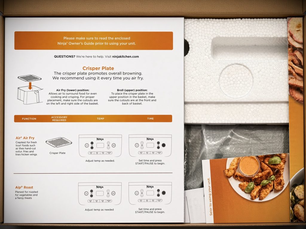 Open Ninja Air Fryer Pro box showing the quick start guide, foam packing and recipe book