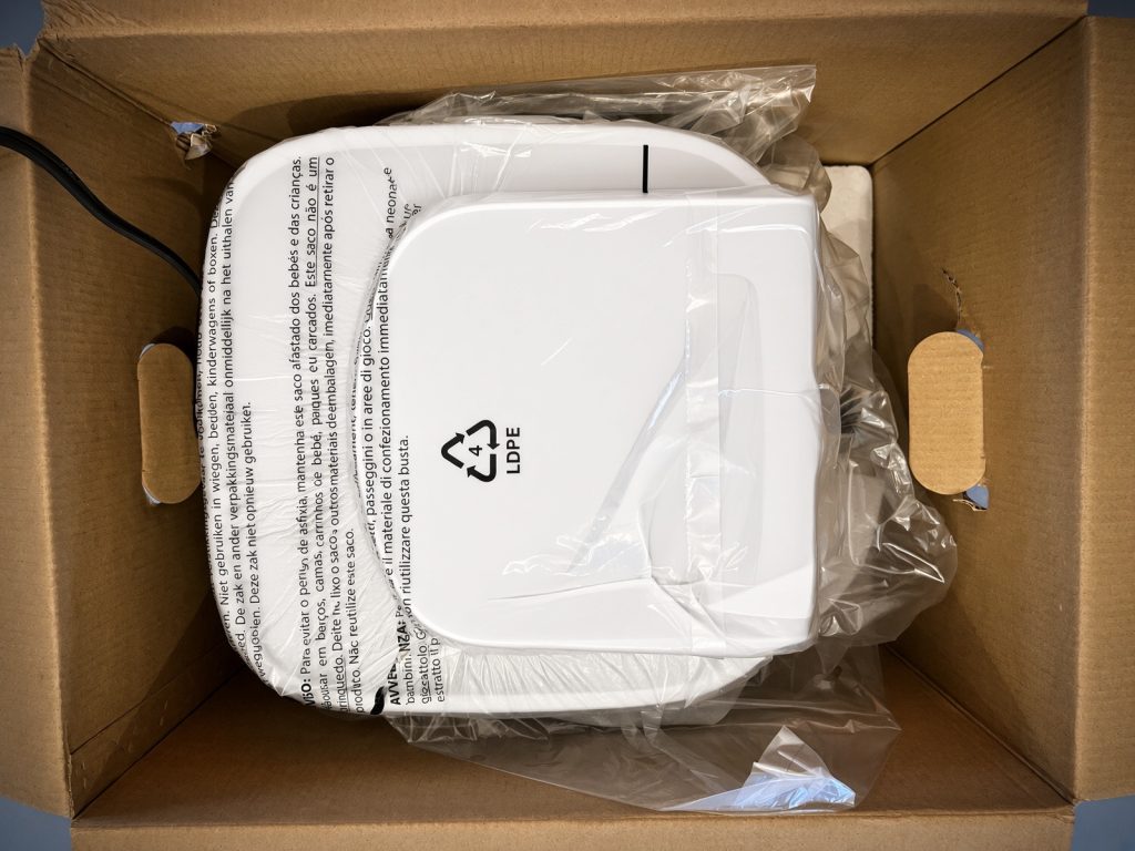 Ninja Air Fryer Pro wrapped in plastic inside the shipping box