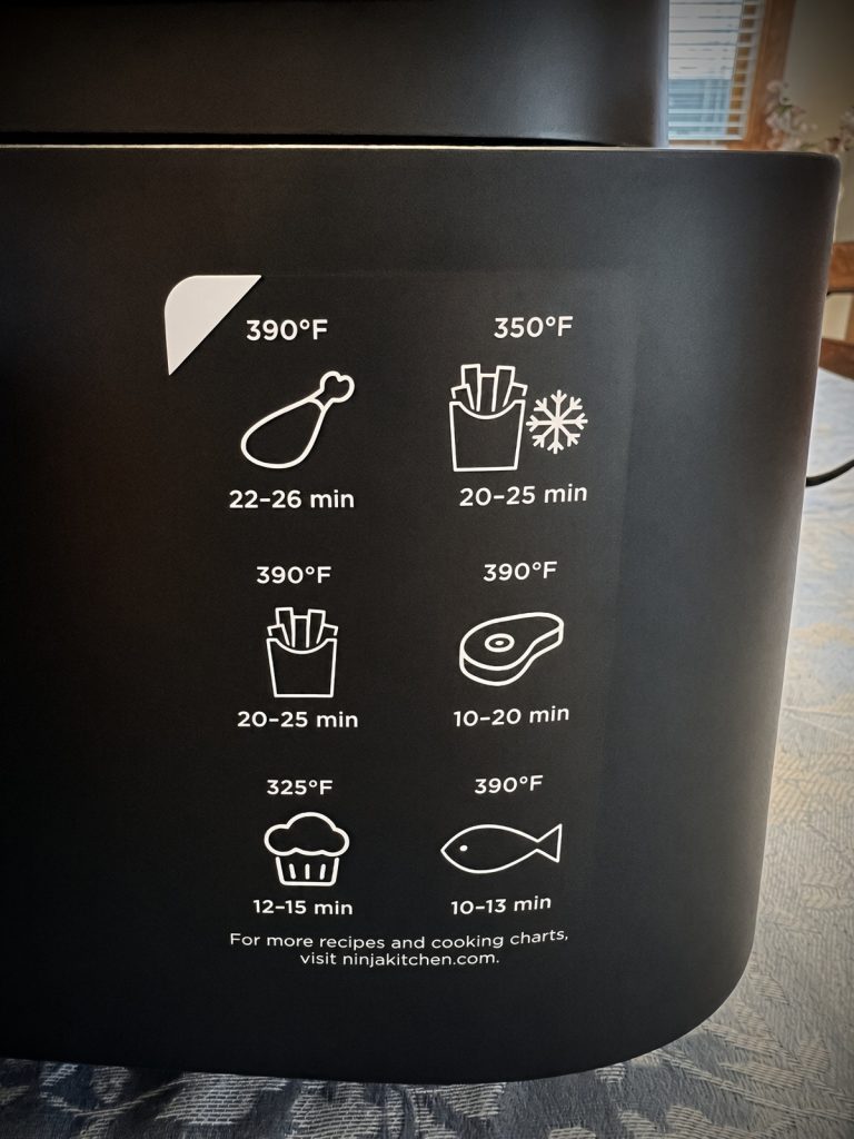 Cooking time and temperature chart printed on the side of the Ninja Air Fryer Pro basket