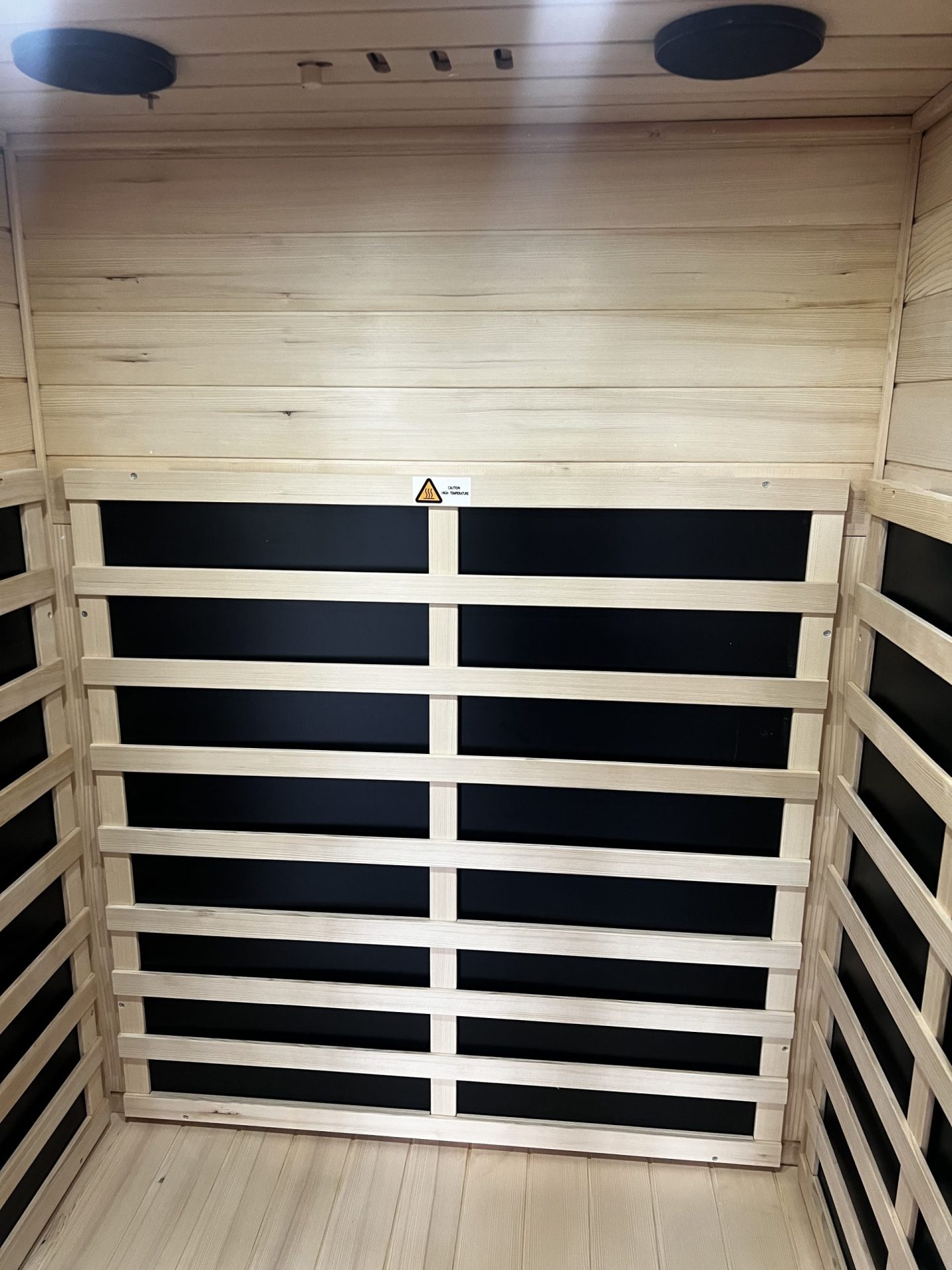 Far infrared carbon heating panels on the back wall of the Kanlanth sauna