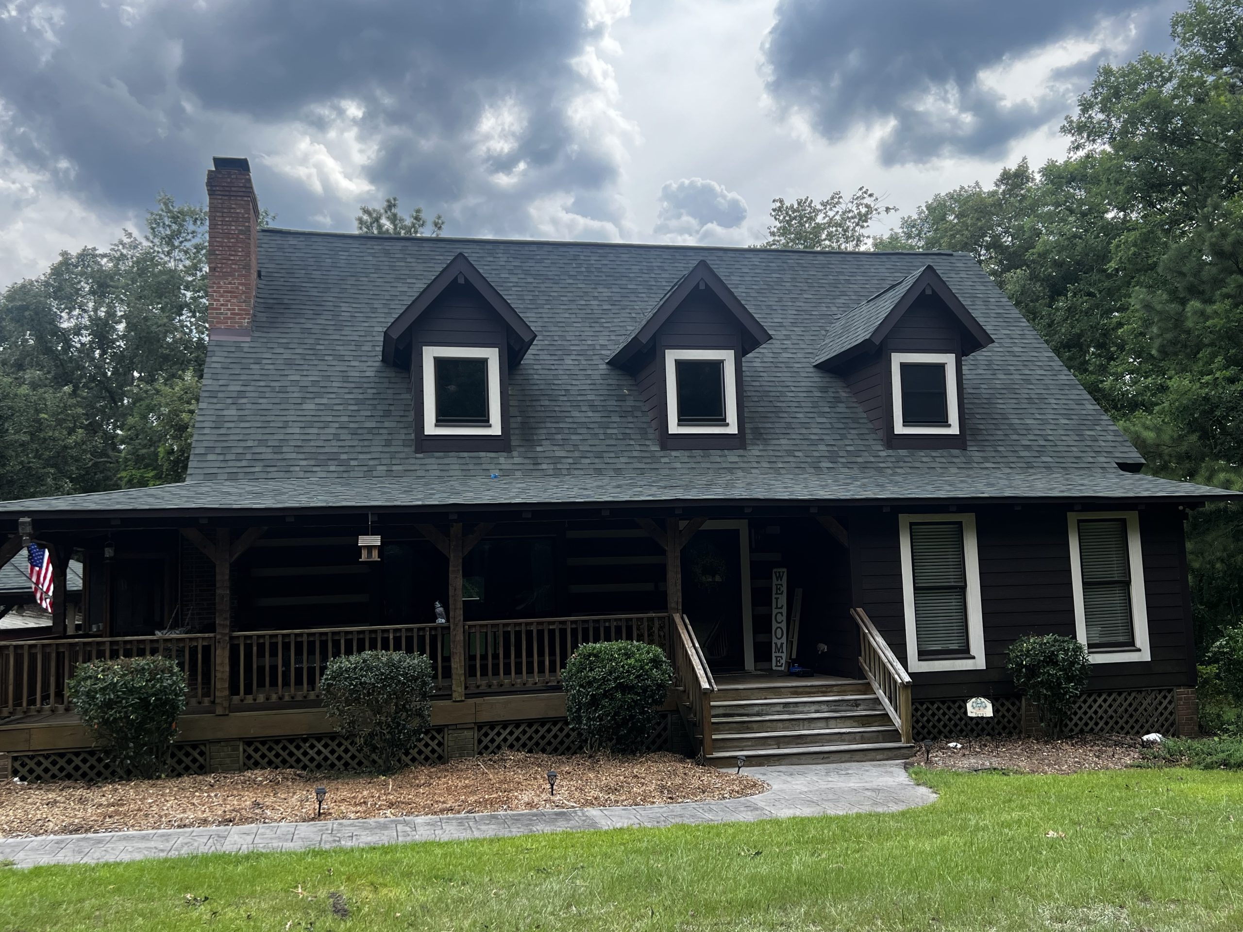 Brandowdale South, Pap Steve's dark log-style home with dormers and a long front porch in Blythewood, SC