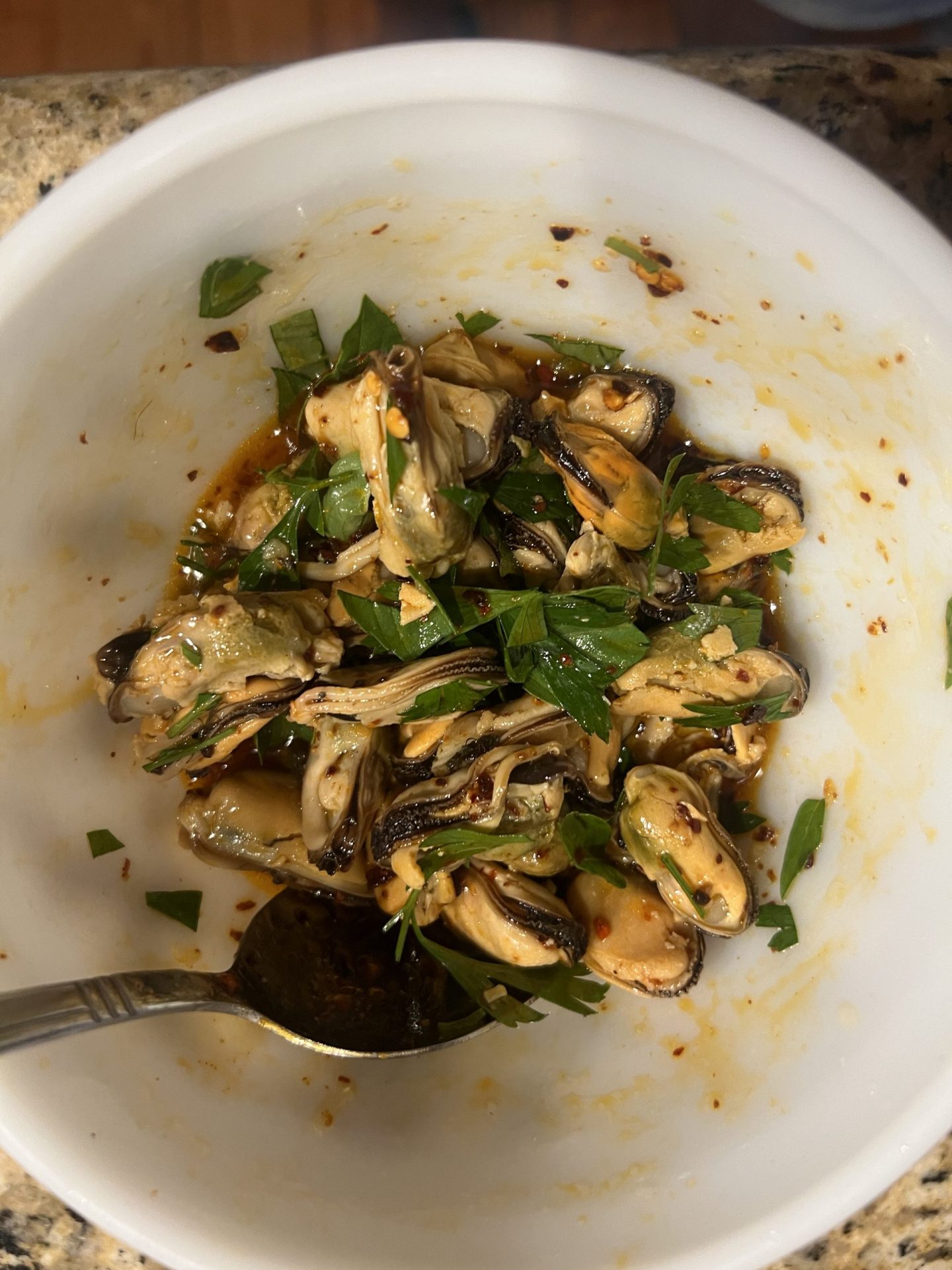 Mussels tossed with lemon, chili oil, garlic and fresh parsley